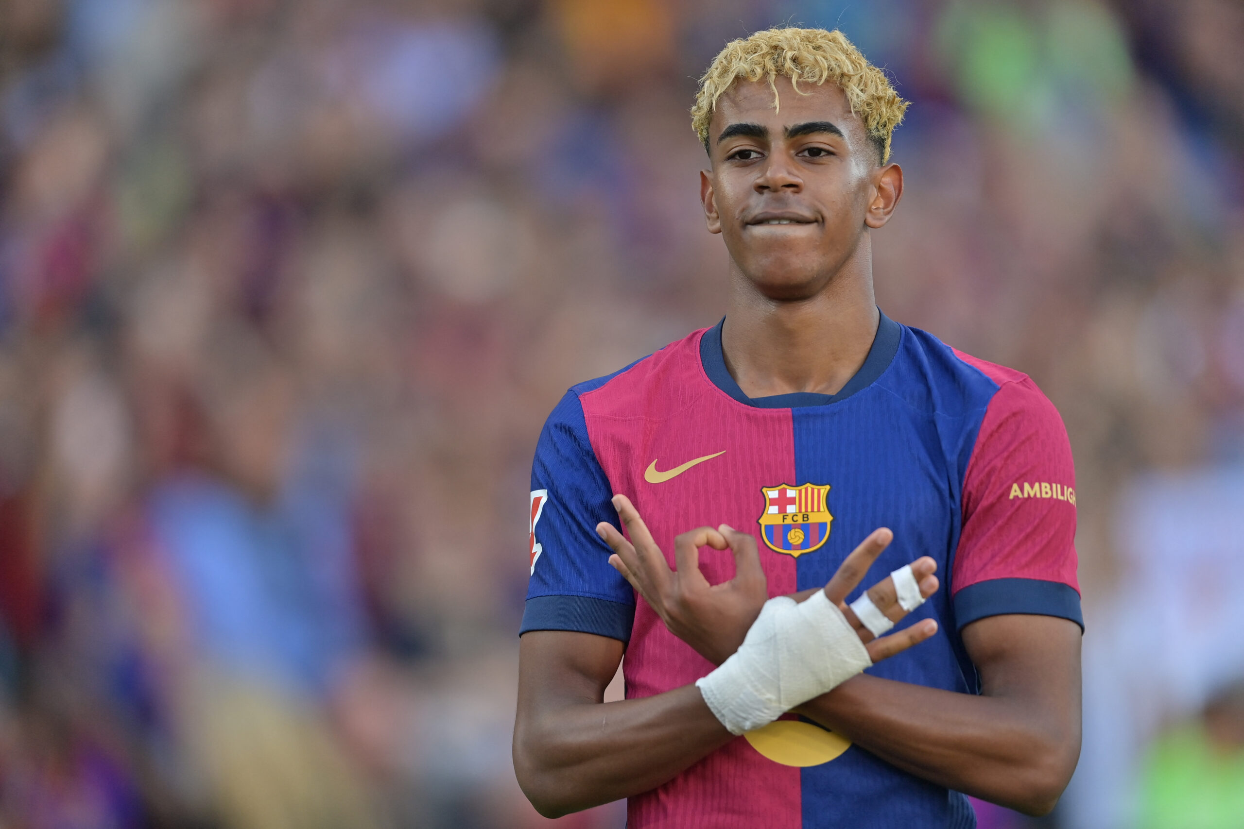 Barcelona's Spanish forward #19 Lamine Yamal celebrates scoring an equalizing goal during the Spanish league football match between FC Barcelona and Villarreal CF at Estadi Olimpic Lluis Companys in Barcelona on May 18, 2025. (Photo by MANAURE QUINTERO / AFP)